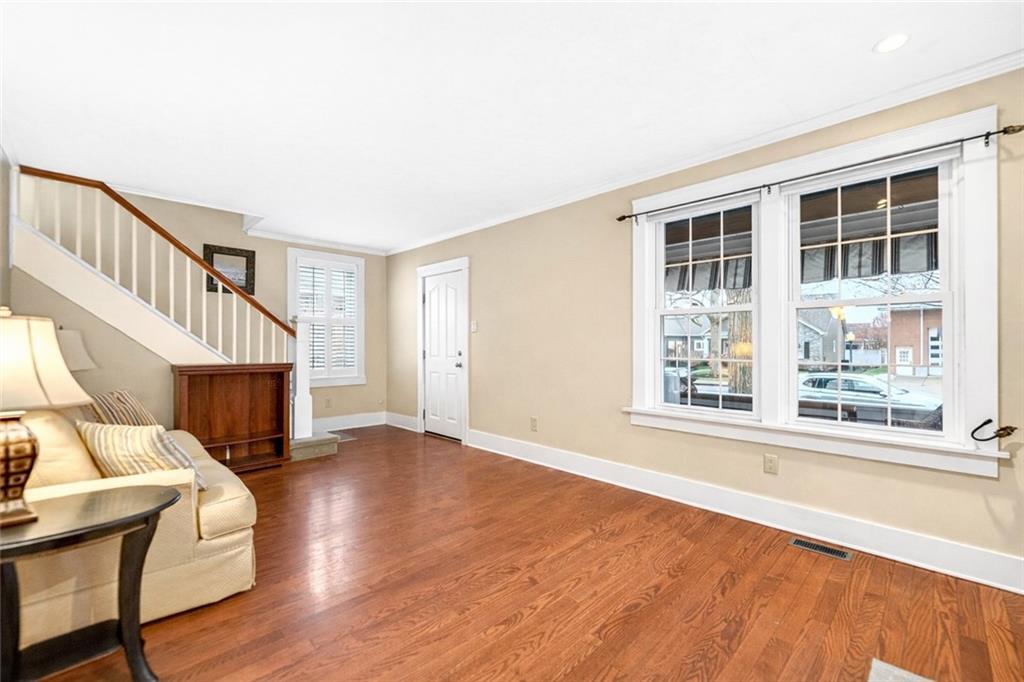 158 Market Street Beaver, PA 15009 - Photo 11 of 38 a view of an empty room with wooden floor and a window