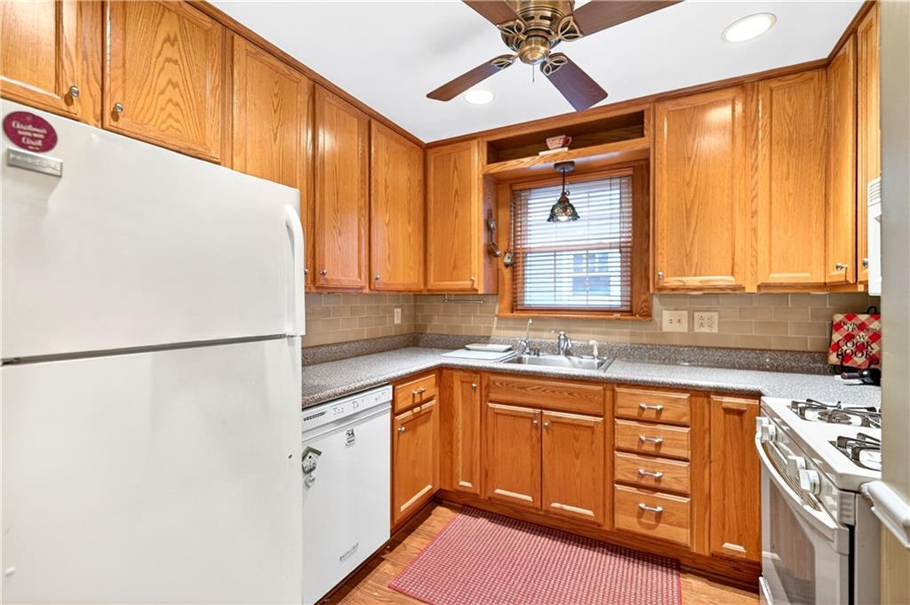 158 Market Street Beaver, PA 15009 - Photo 18 of 38 a kitchen with a sink a refrigerator and window