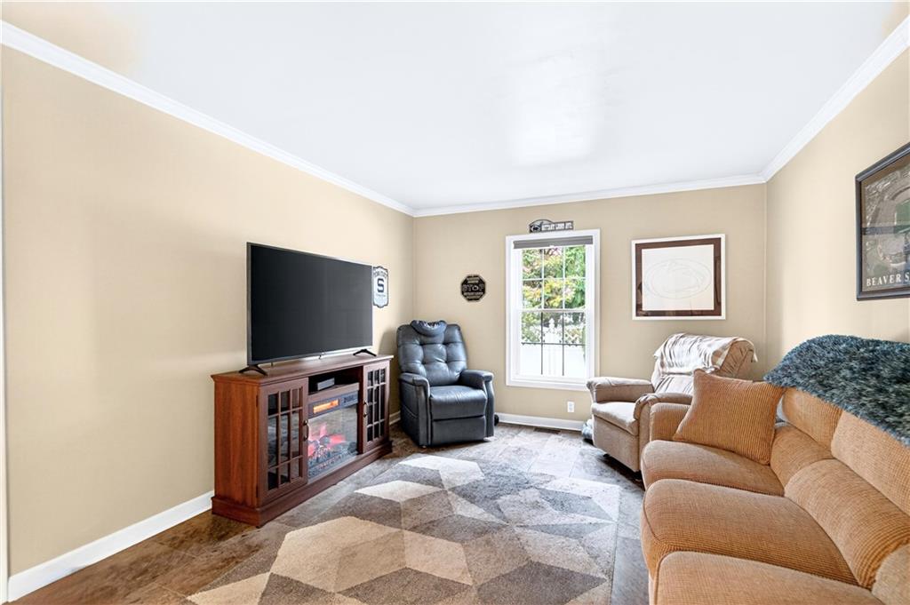 158 Market Street Beaver, PA 15009 - Photo 23 of 38 a living room with furniture and a flat screen tv