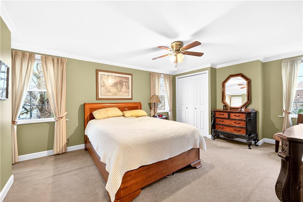 158 Market Street Beaver, PA 15009 - Photo 27 of 38 a bedroom with a bed a chandelier and a dresser