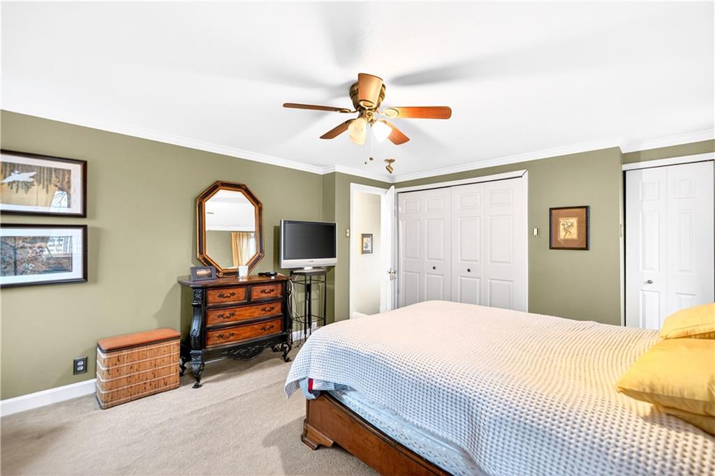 158 Market Street Beaver, PA 15009 - Photo 29 of 38 a bedroom with a bed and a chandelier