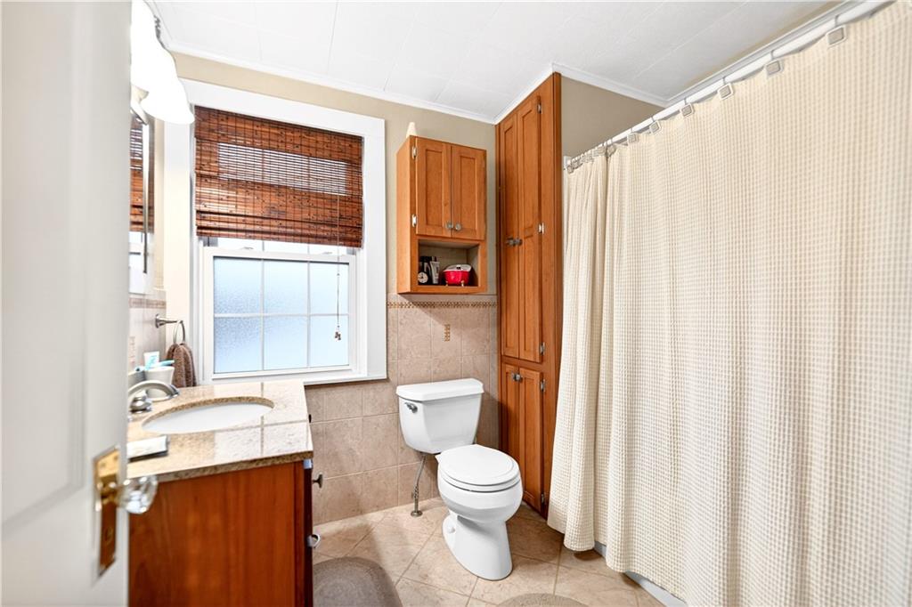 158 Market Street Beaver, PA 15009 - Photo 30 of 38 a bathroom with a toilet a sink and a window