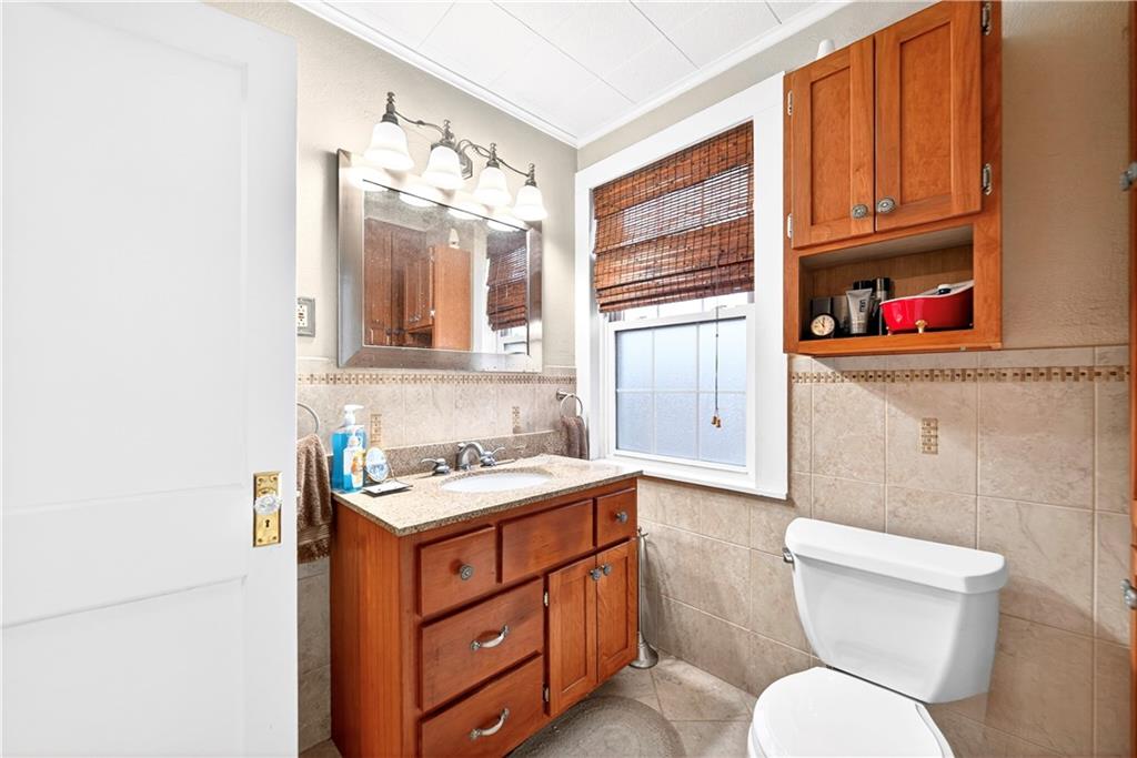 158 Market Street Beaver, PA 15009 - Photo 31 of 38 a bathroom with a toilet a sink and a mirror
