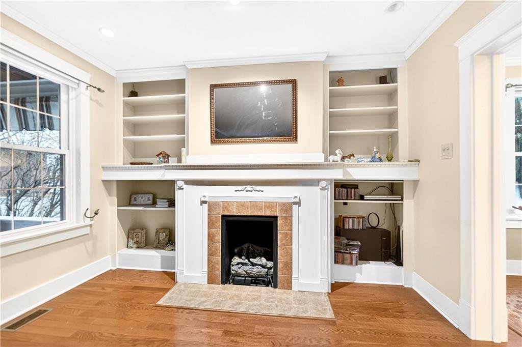 158 Market Street Beaver, PA 15009 - Photo 10 of 38 a living room with a fireplace and windows