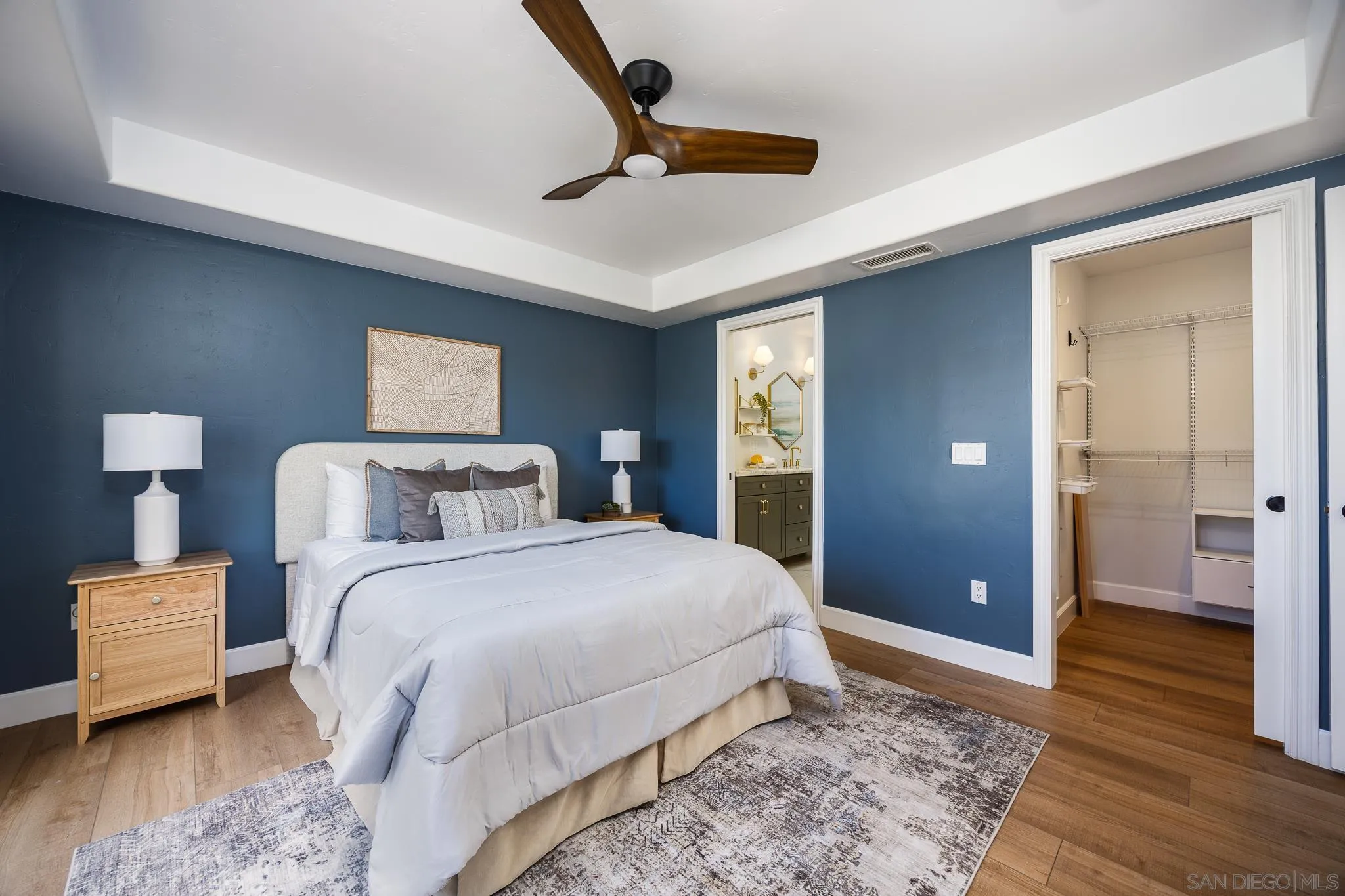 3986 Riviera Drive San Diego, CA 92109 - Photo 14 of 35 a bedroom with a bed and a walk in closet