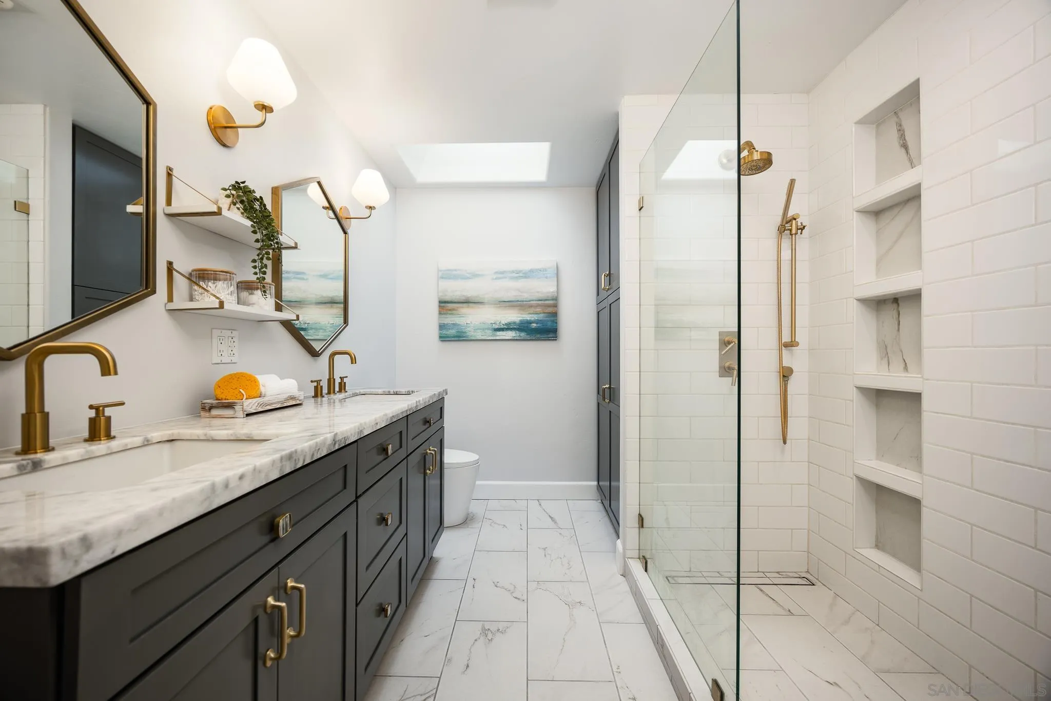 3986 Riviera Drive San Diego, CA 92109 - Photo 16 of 35 a spacious bathroom with a granite countertop sink a mirror and shower