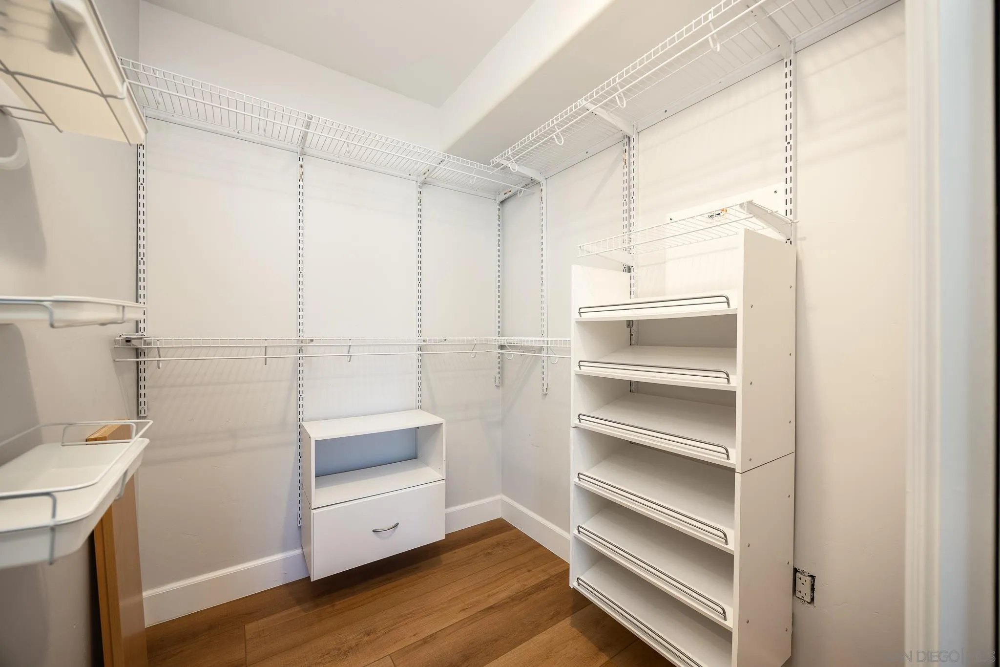 3986 Riviera Drive San Diego, CA 92109 - Photo 17 of 35 a view of walk in closet with empty racks