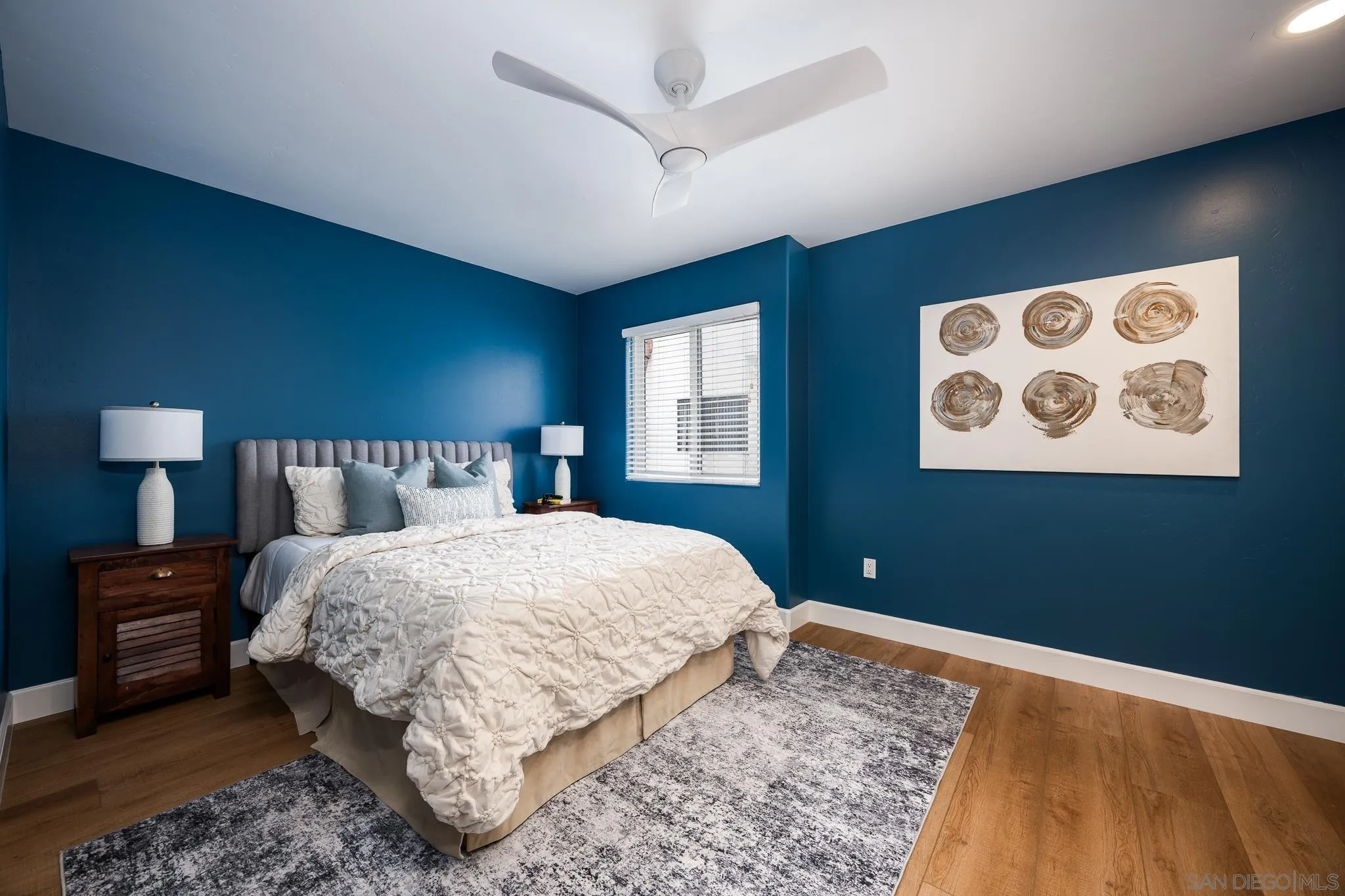 3986 Riviera Drive San Diego, CA 92109 - Photo 21 of 35 a bedroom with bed and a night stand