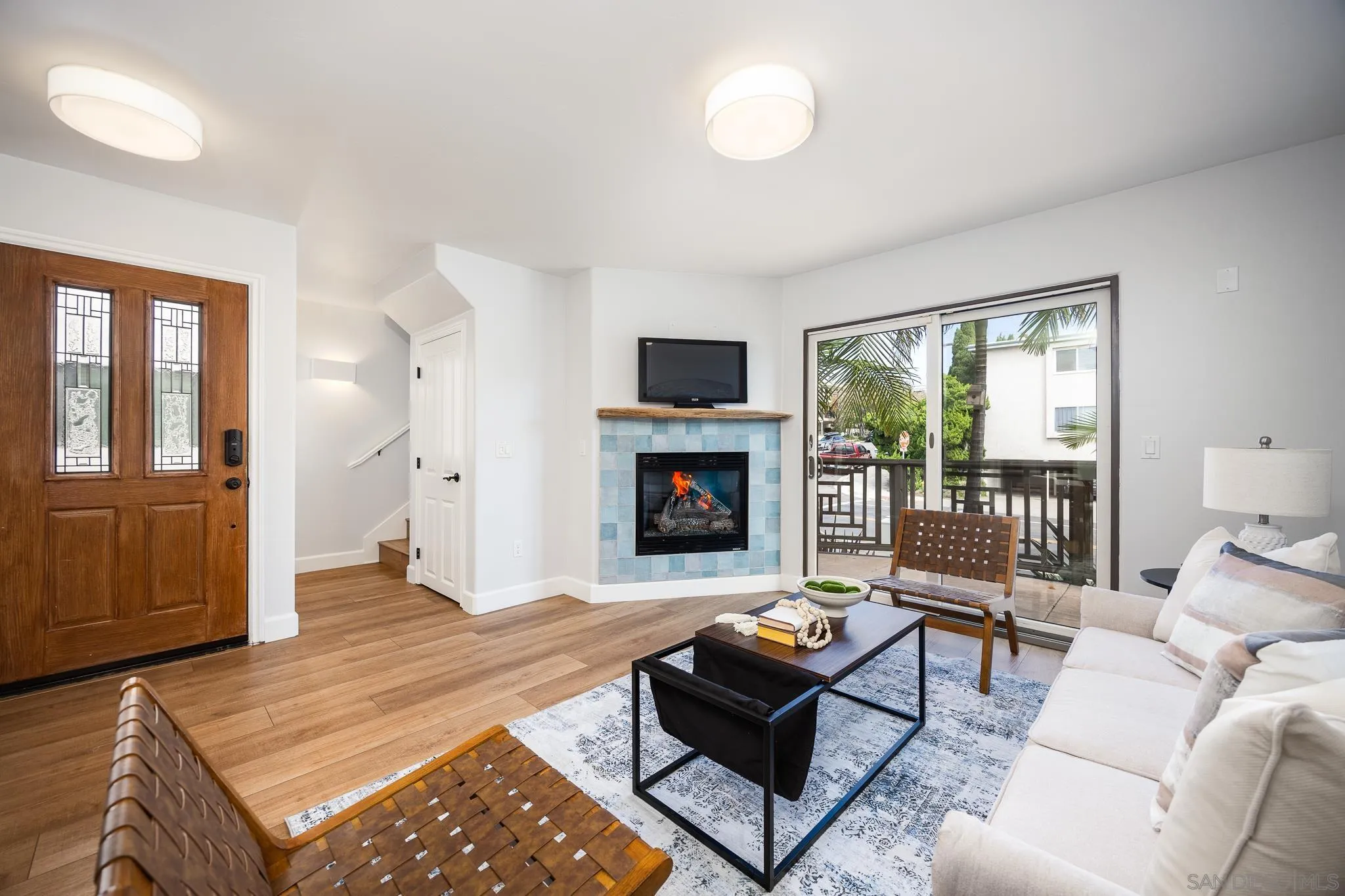 3986 Riviera Drive San Diego, CA 92109 - Photo 4 of 35 a living room with furniture and a fireplace