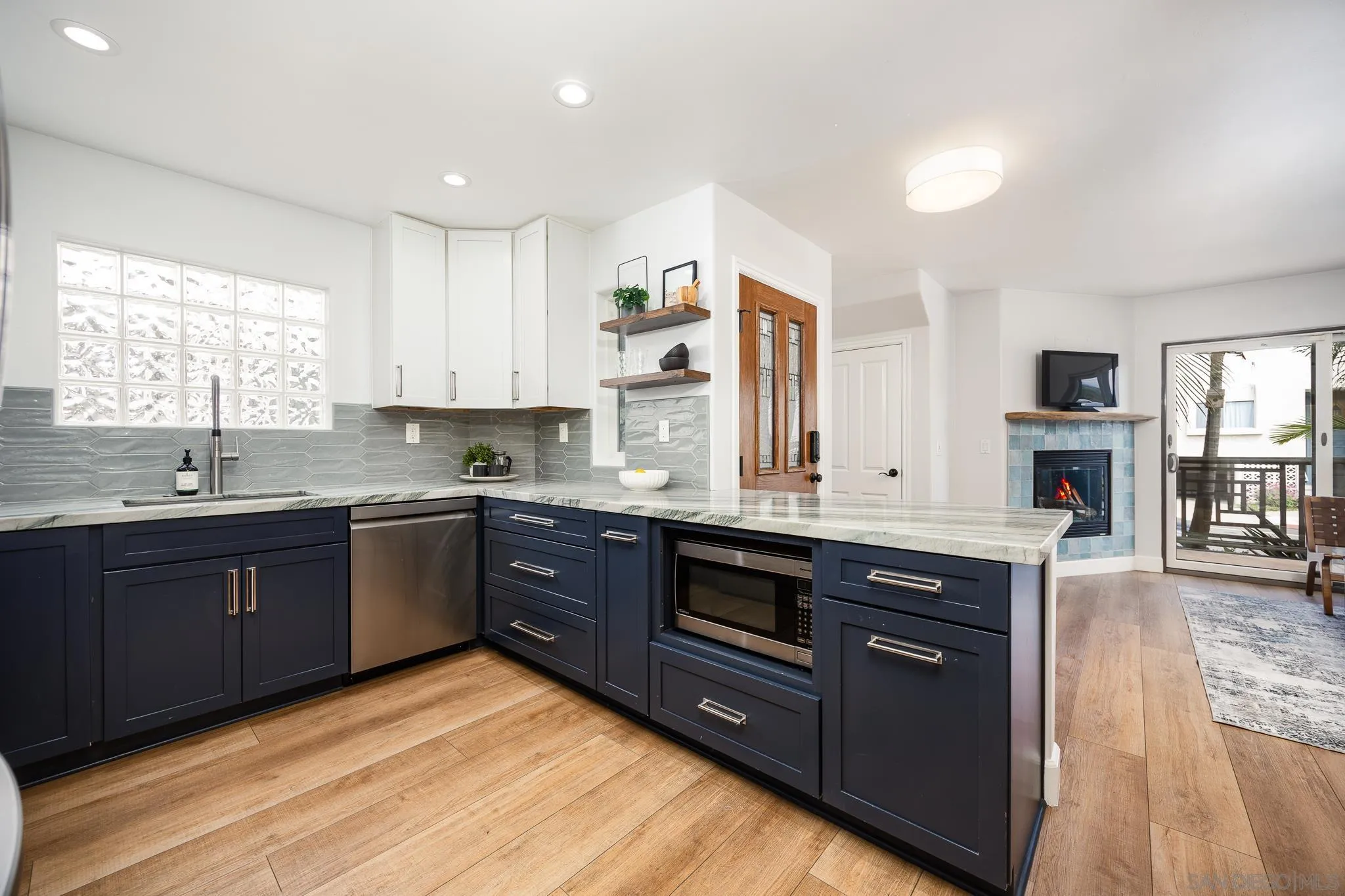 3986 Riviera Drive San Diego, CA 92109 - Photo 9 of 35 a large kitchen with stainless steel appliances granite countertop a stove a sink dishwasher and a refrigerator