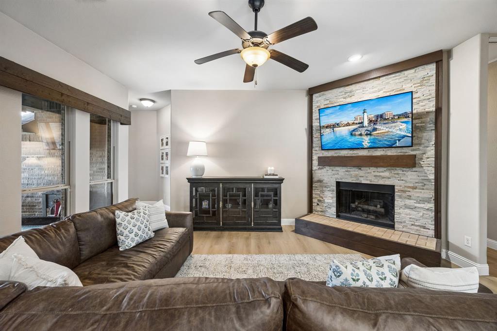 3917 Gatewick Drive Rockwall, TX 75087 - Photo 9 of 34 a living room with furniture and a fireplace