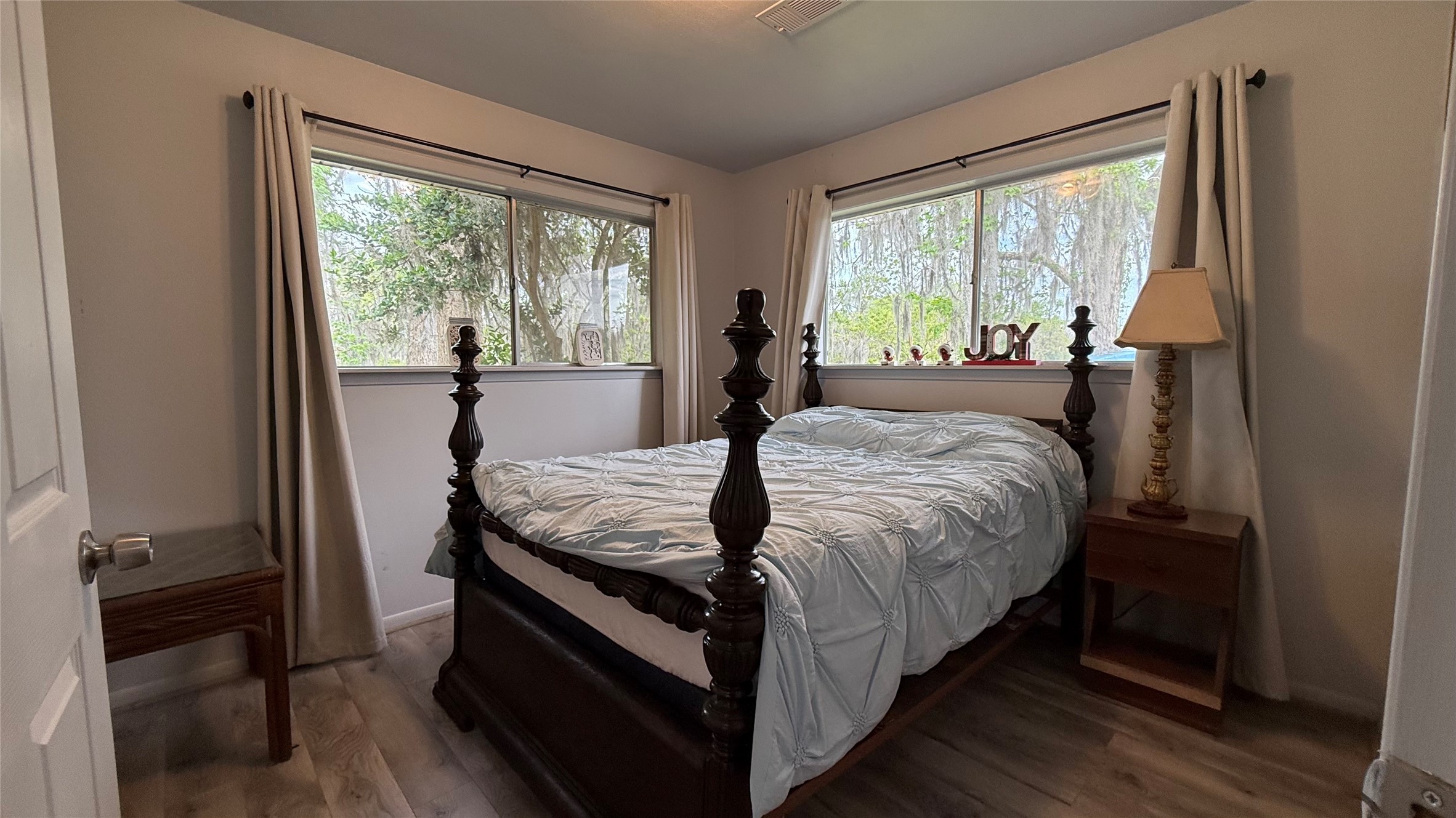 215 Weldon Livingston, TX 77351 - Photo 16 of 22 a bed sitting in a bedroom next to a window