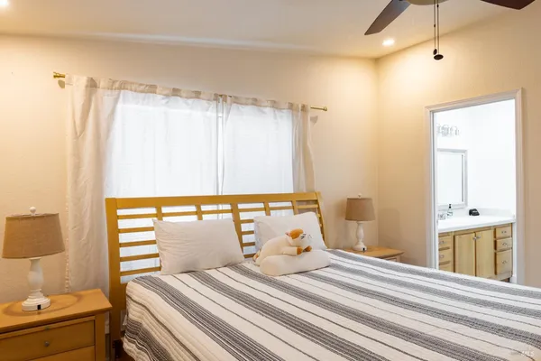 a bedroom with a bed and a window