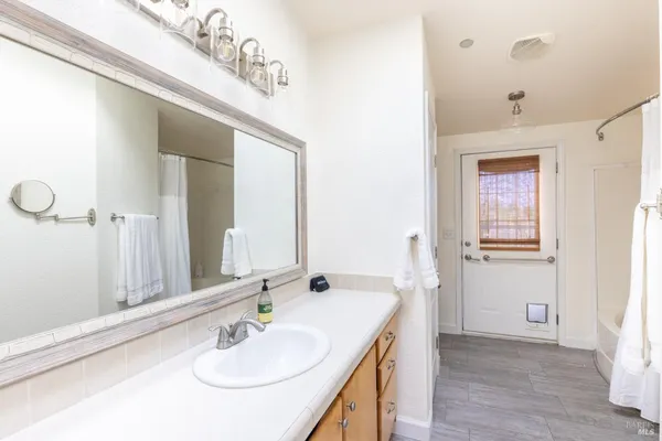 a bathroom with a sink and a mirror