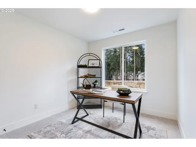 a room with a table and windows