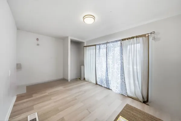 a view of a car parked in front of a house