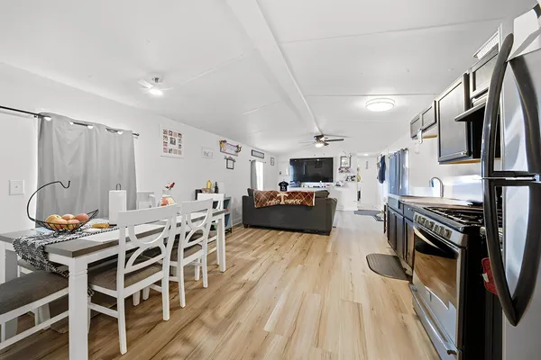 a dining room with wooden floor and breakfast area