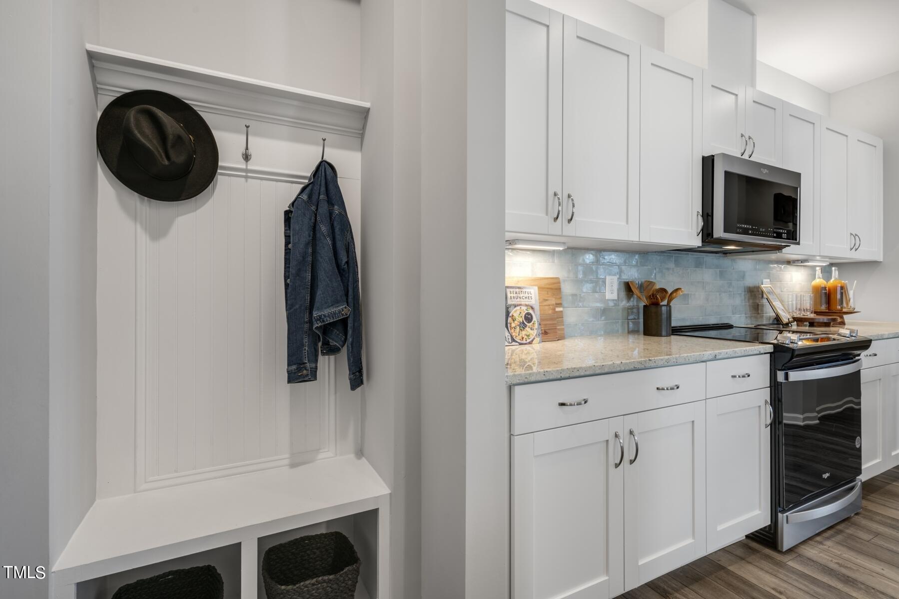 168 Siebold Street Garner, NC 27529 - Photo 25 of 59 a kitchen with white cabinets and a stainless steel appliances