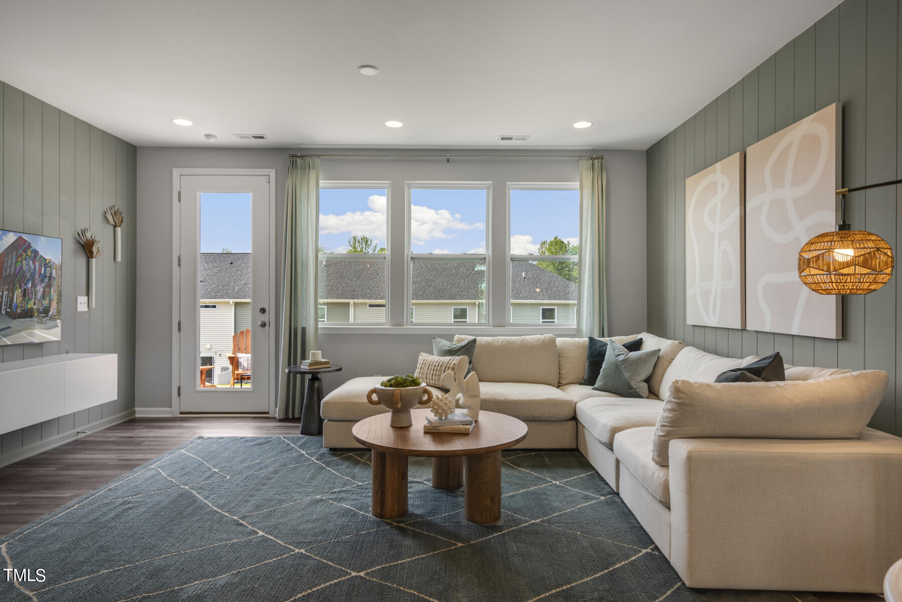 168 Siebold Street Garner, NC 27529 - Photo 32 of 59 a living room with furniture and floor to ceiling window