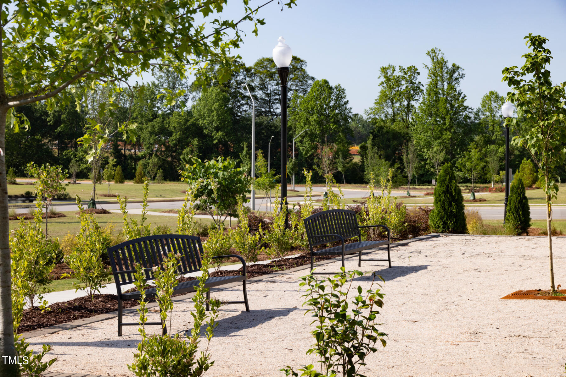 168 Siebold Street Garner, NC 27529 - Photo 38 of 59 a view of a park with swings and slides