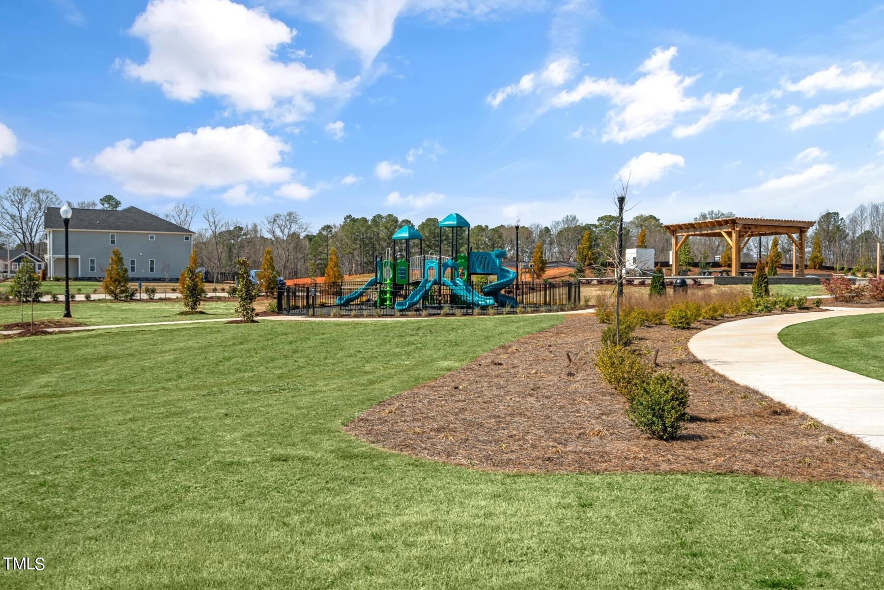 168 Siebold Street Garner, NC 27529 - Photo 56 of 59 a view of a playground with basketball court