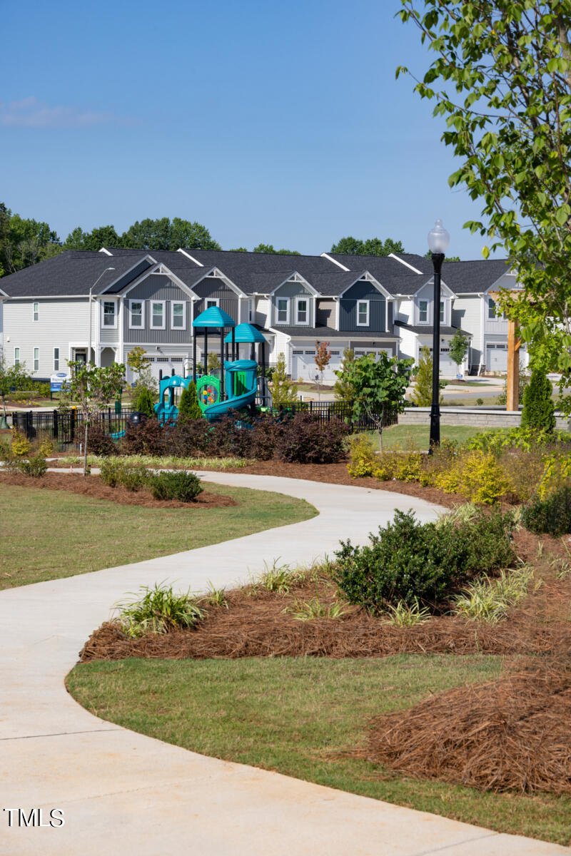 168 Siebold Street Garner, NC 27529 - Photo 58 of 59 a front view of a house with a yard