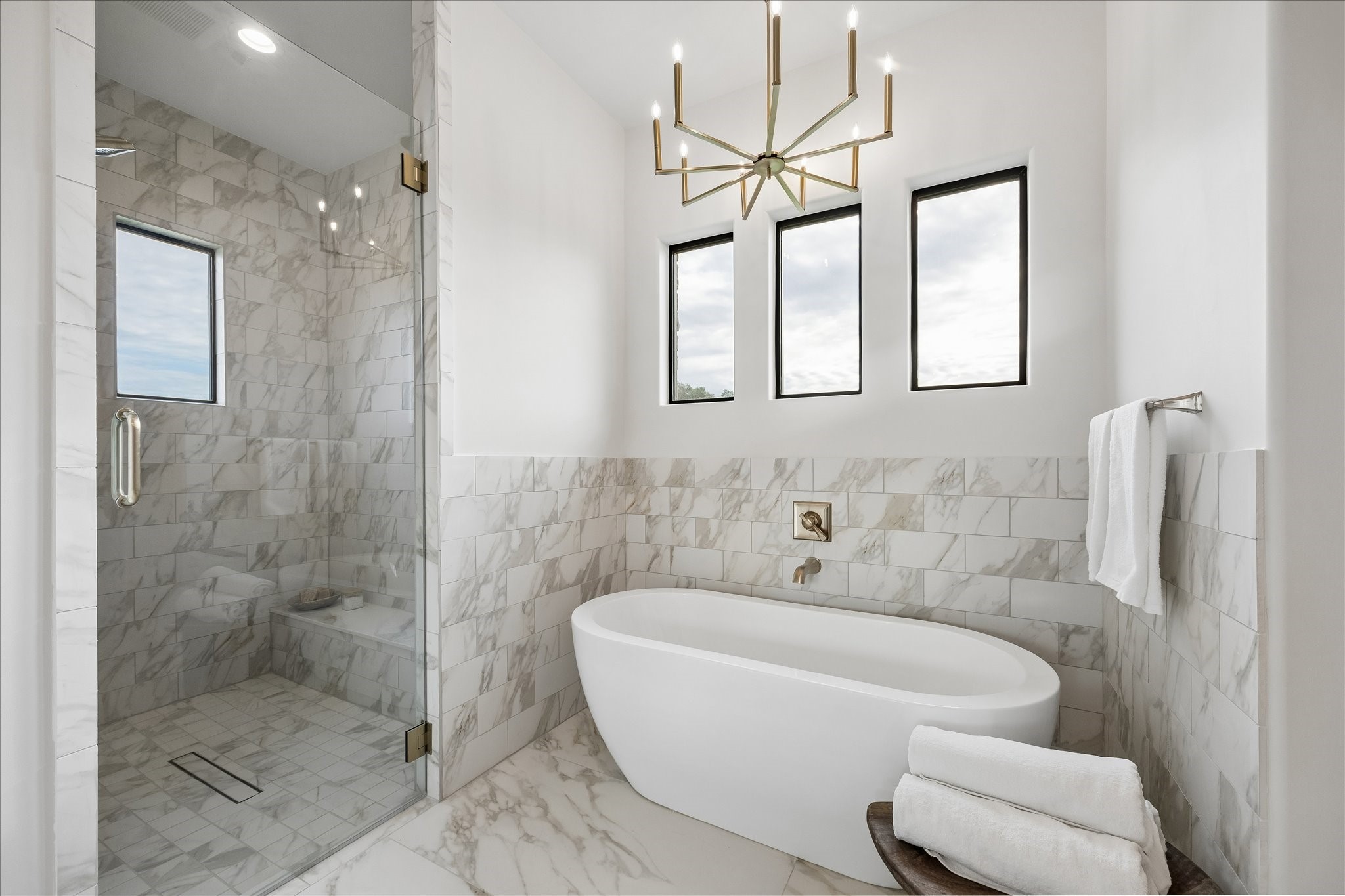 4961 Hartfield Road Round Top, TX 78954 - Photo 17 of 33 a bathroom with a bathtub and a shower