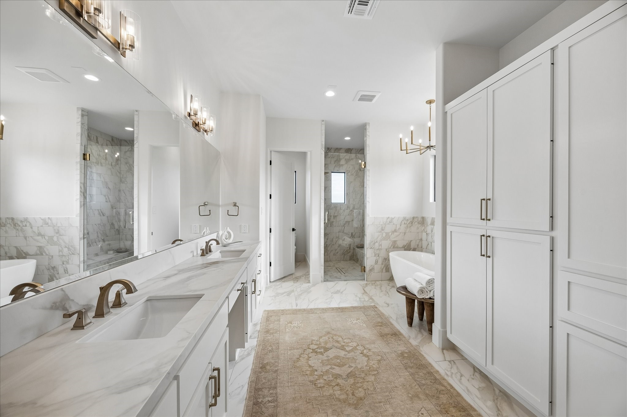 4961 Hartfield Road Round Top, TX 78954 - Photo 18 of 33 a bathroom with a double vanity sink mirror double and shower