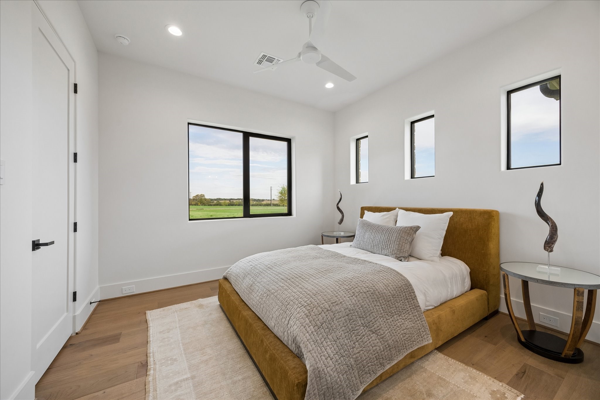 4961 Hartfield Road Round Top, TX 78954 - Photo 19 of 33 a bedroom with a bed and a window