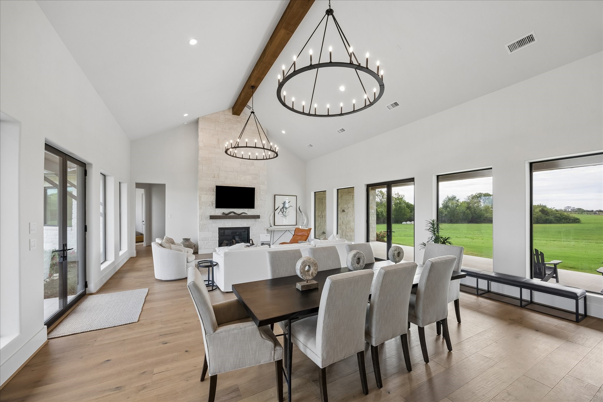 4961 Hartfield Road Round Top, TX 78954 - Photo 22 of 33 a view of dining room and livingroom with furniture window and wooden floor