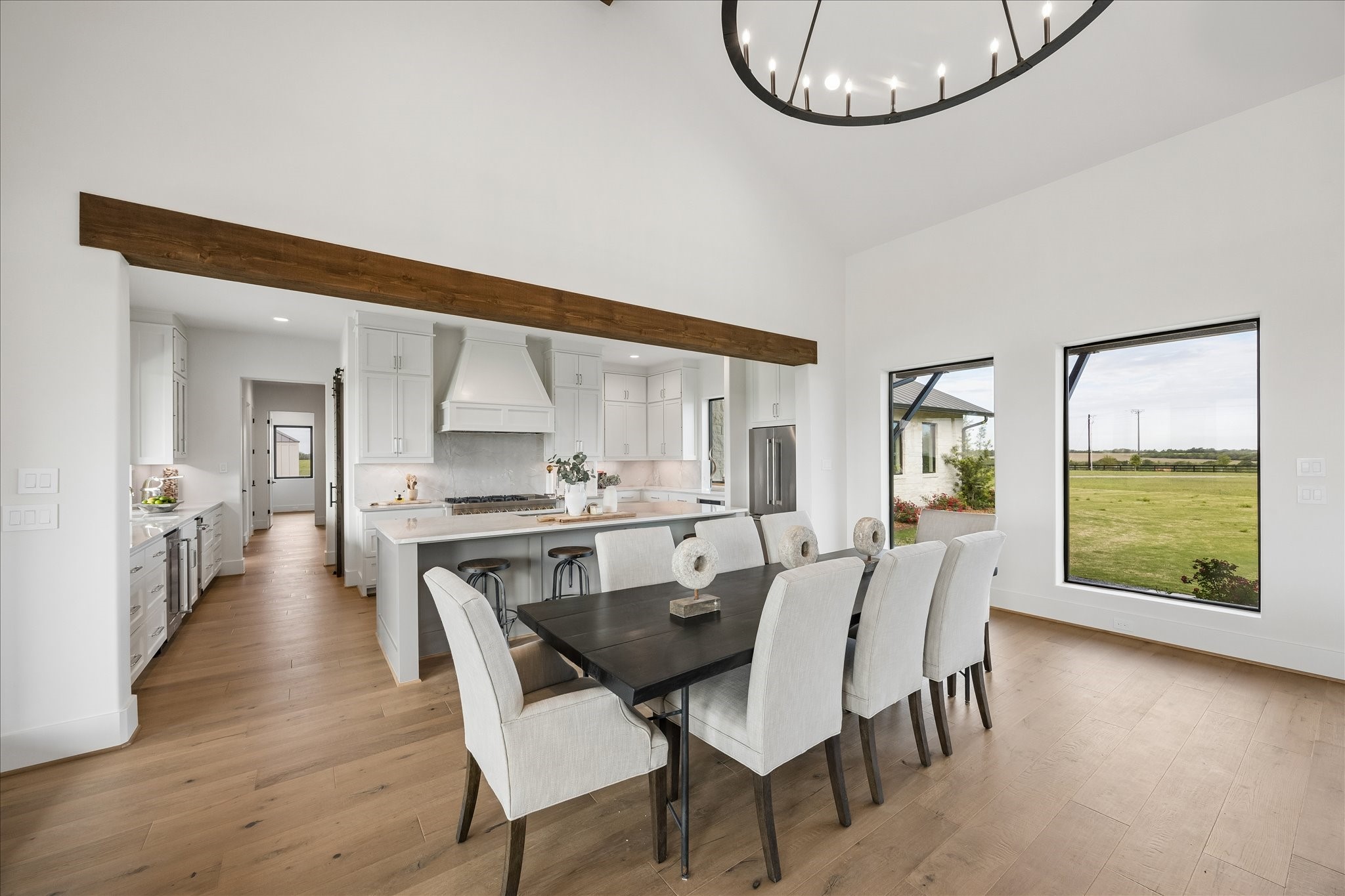 4961 Hartfield Road Round Top, TX 78954 - Photo 23 of 33 a view of a dining room with furniture window and wooden floor