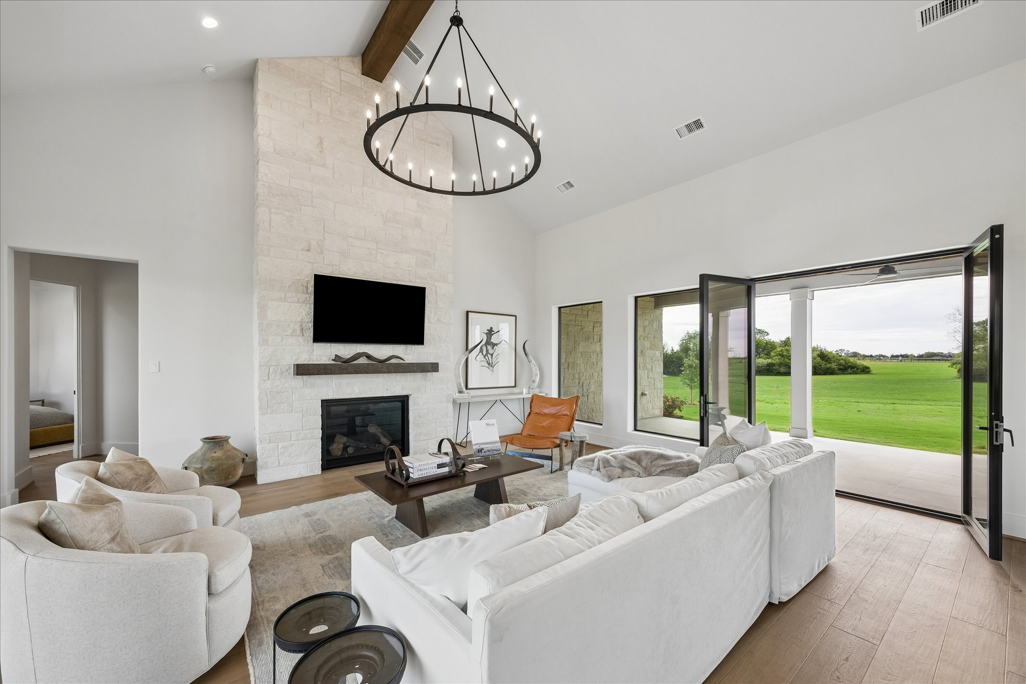 4961 Hartfield Road Round Top, TX 78954 - Photo 24 of 33 a living room with fireplace furniture and a flat screen tv