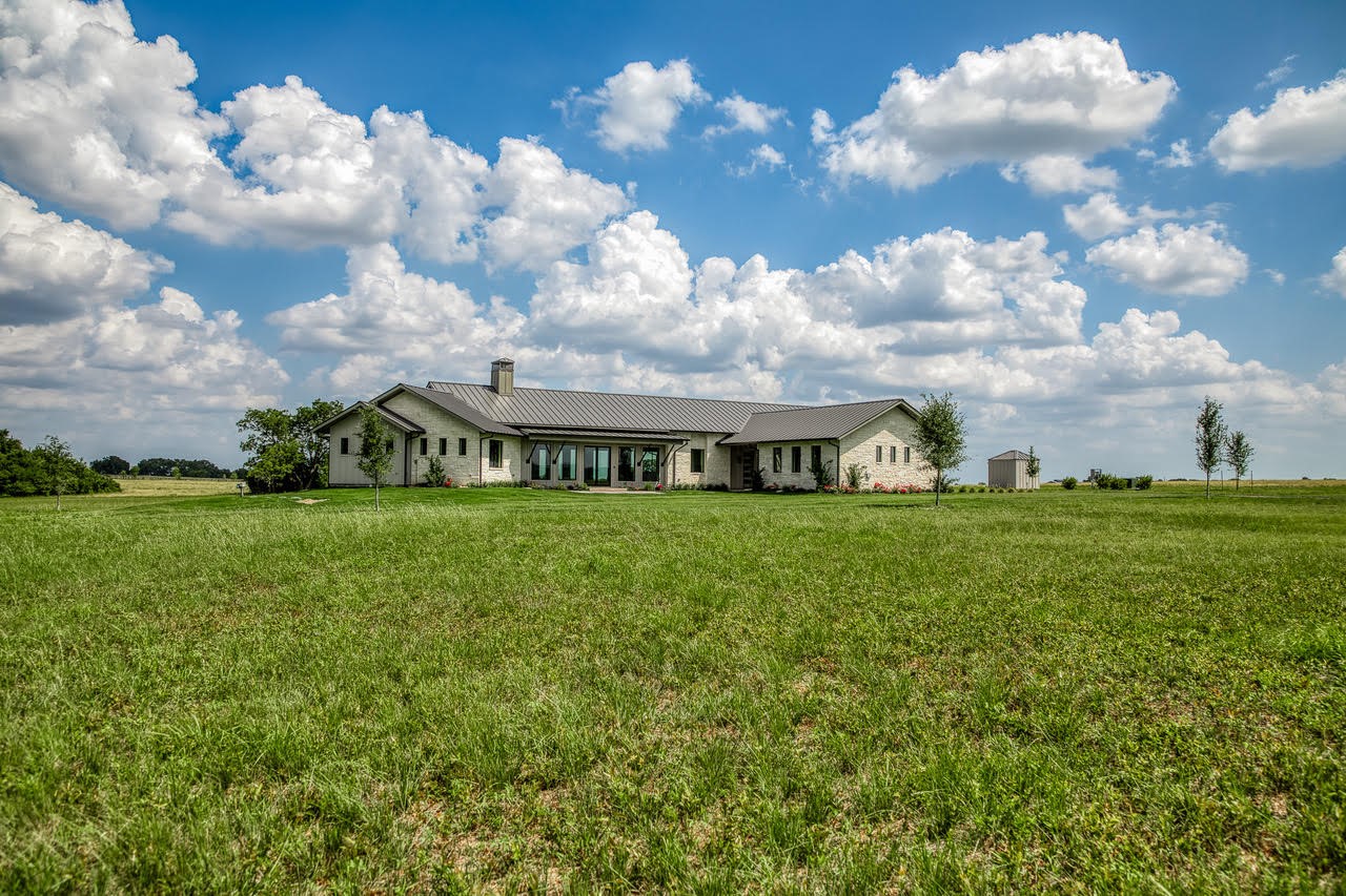 4961 Hartfield Road Round Top, TX 78954 - Photo 30 of 33 a front view of a house with garden
