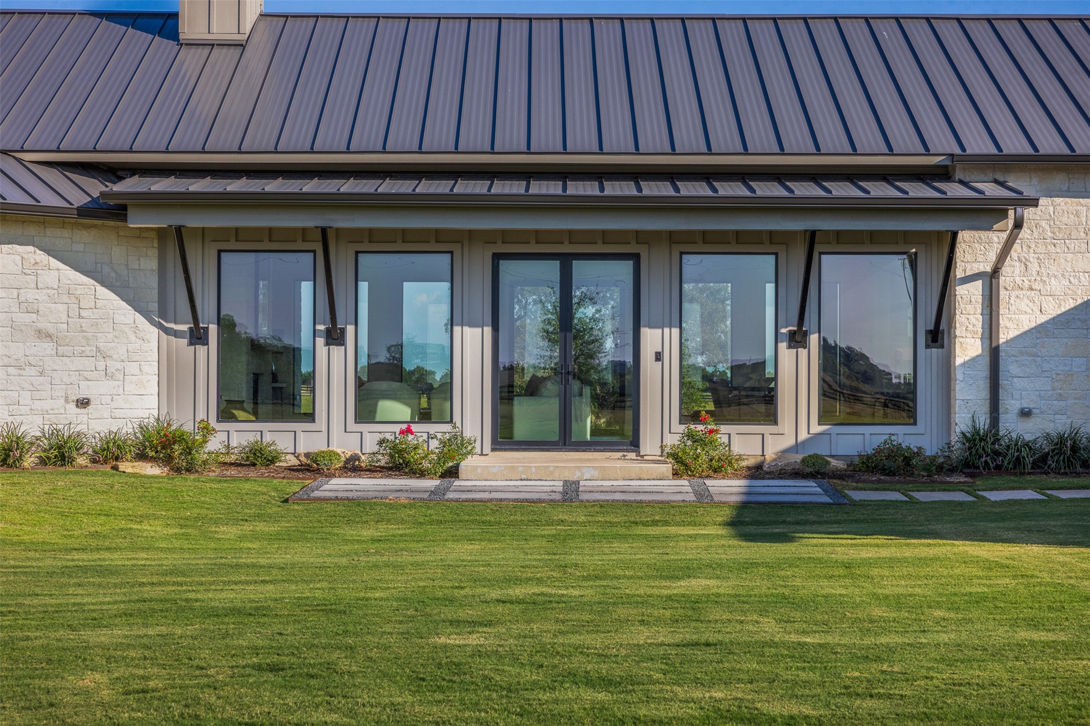4961 Hartfield Road Round Top, TX 78954 - Photo 3 of 33 a view of a house with a swimming pool and outdoor seating
