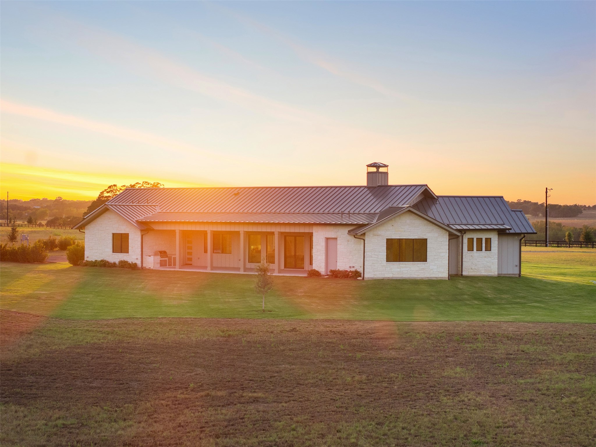 4961 Hartfield Road Round Top, TX 78954 - Photo 33 of 33 a front view of a house with garden