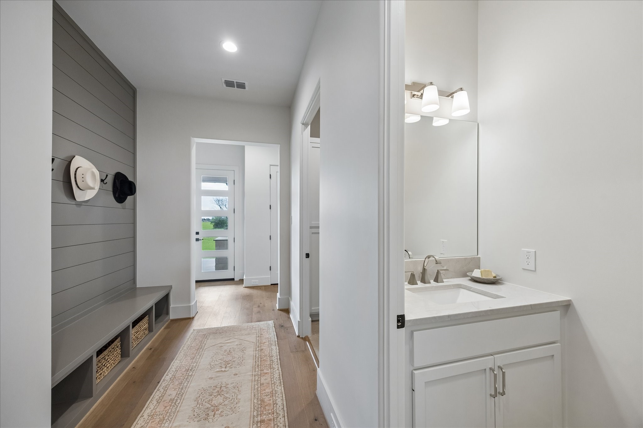 4961 Hartfield Road Round Top, TX 78954 - Photo 5 of 33 a bathroom with a sink vanity and a mirror