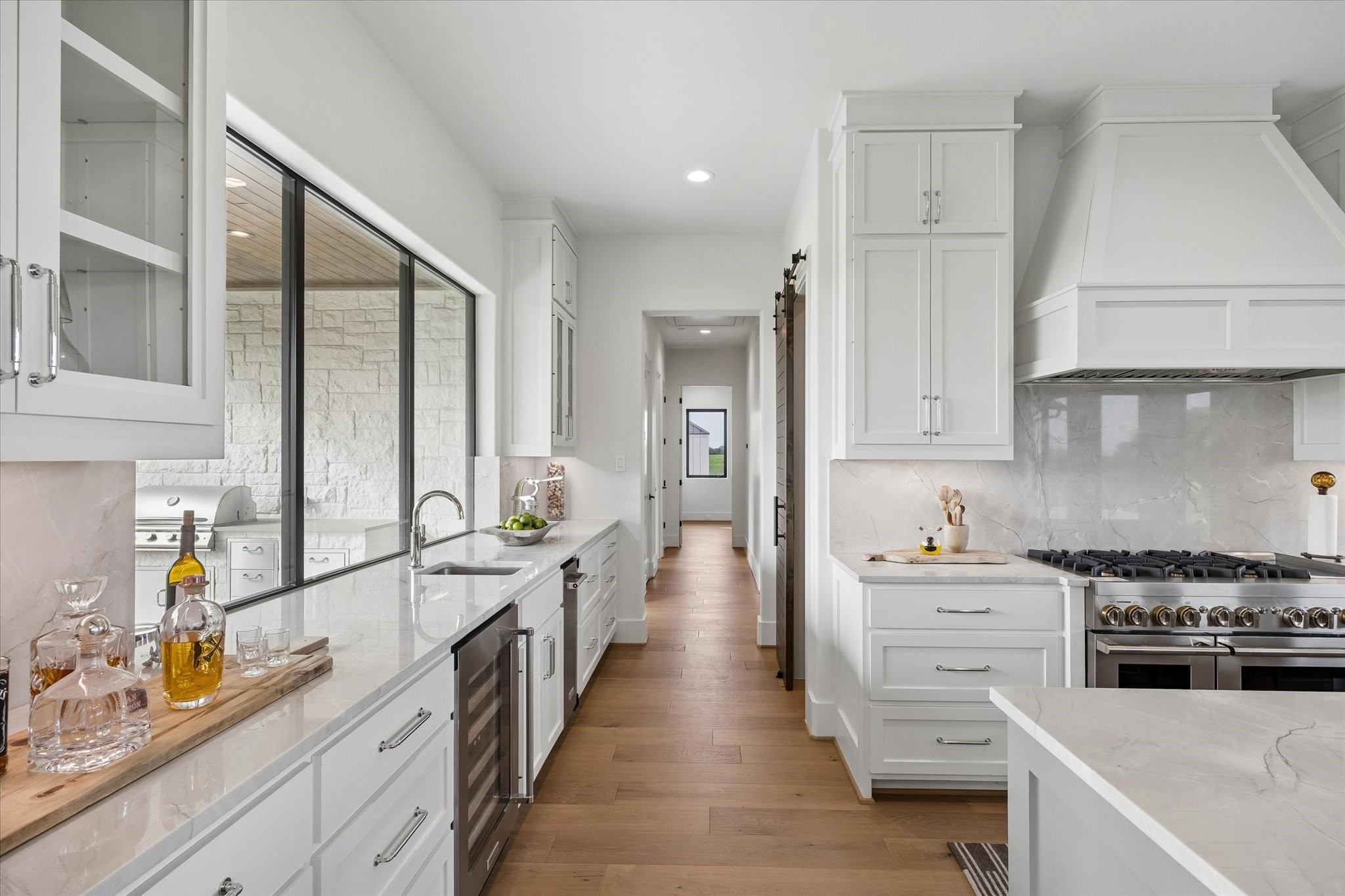 4961 Hartfield Road Round Top, TX 78954 - Photo 9 of 33 a kitchen with stainless steel appliances a stove top oven and a refrigerator