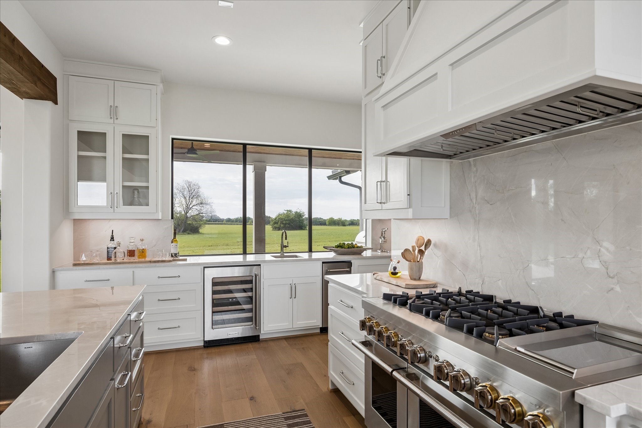 4961 Hartfield Road Round Top, TX 78954 - Photo 10 of 33 a kitchen with a stove a sink and a window