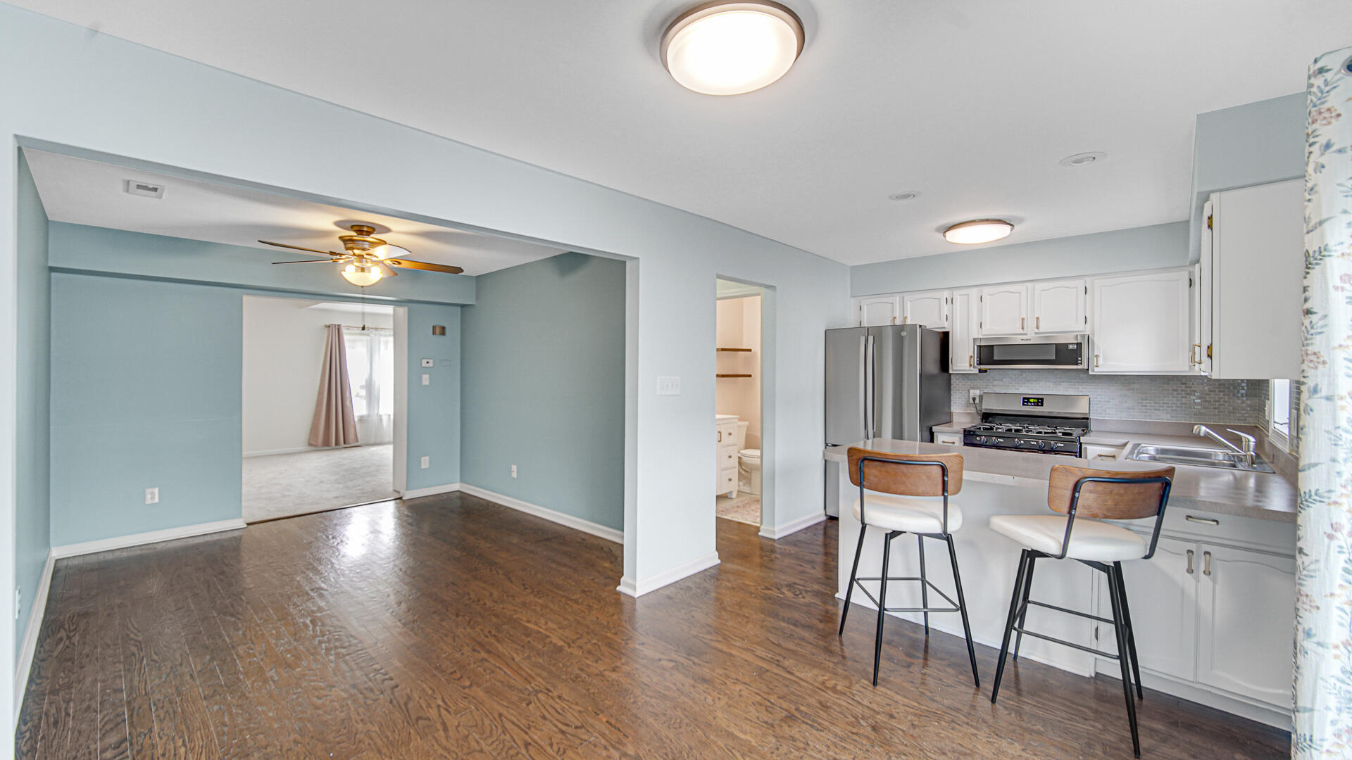 771 Kenmare Parkway Crown Point, IN 46307 - Photo 4 of 20 a view of a kitchen with furniture and wooden floor