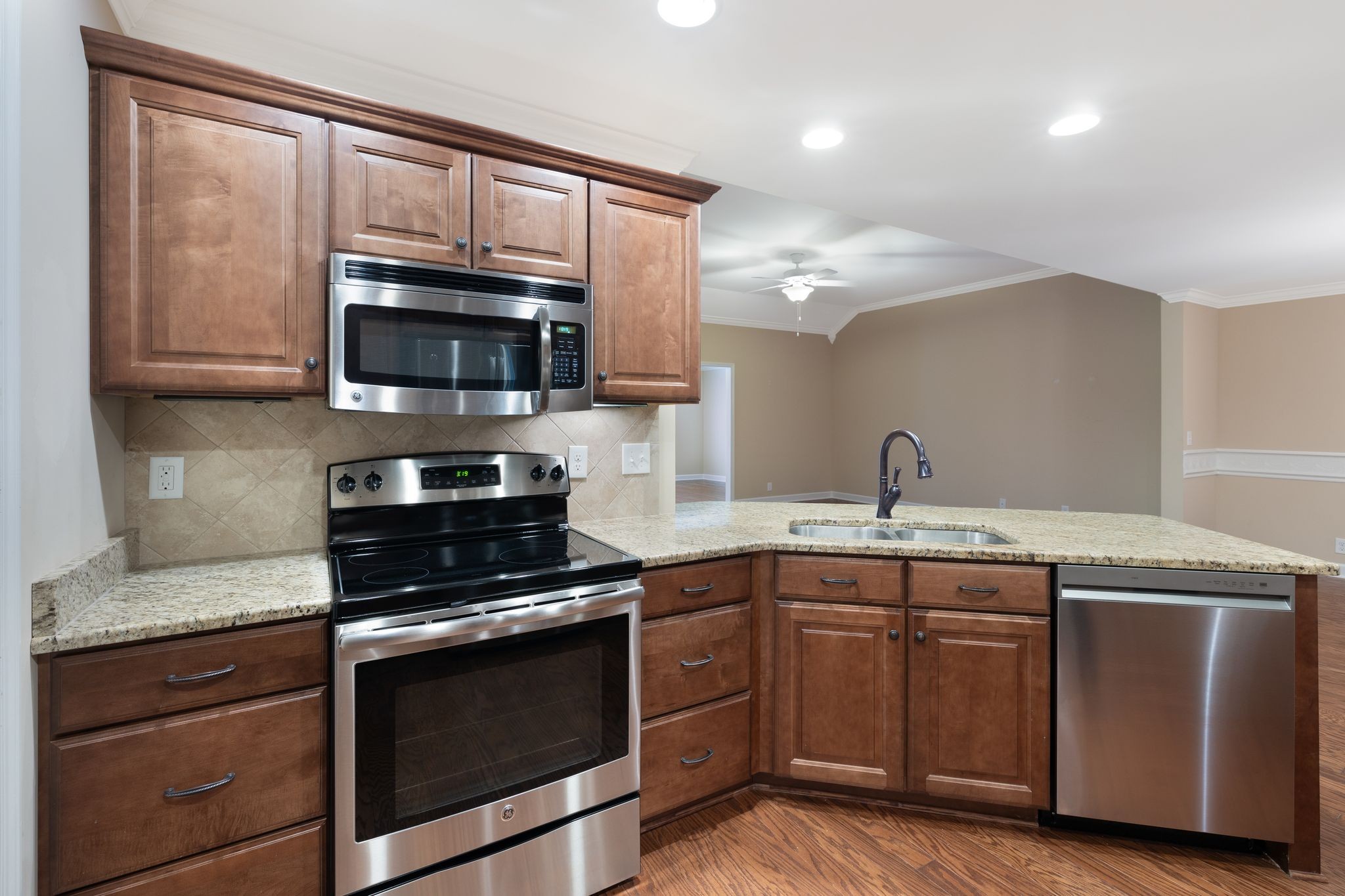 3259 Mershon Drive Murfreesboro, TN 37128 - Photo 5 of 21 a kitchen with granite countertop a sink and steel appliances