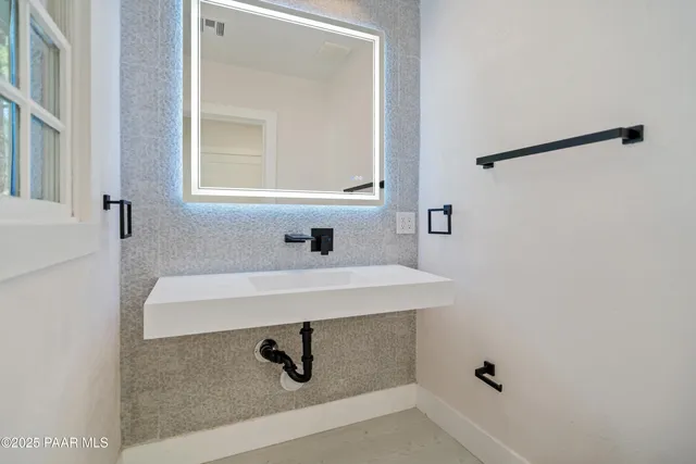 a view of a kitchen with furniture and a kitchen