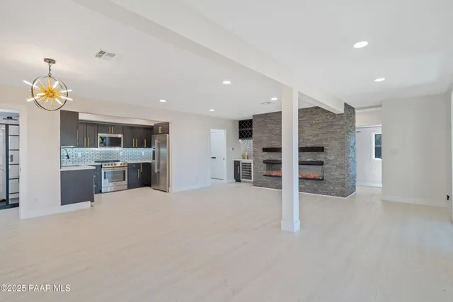 a view of a pathway with a wrought fence