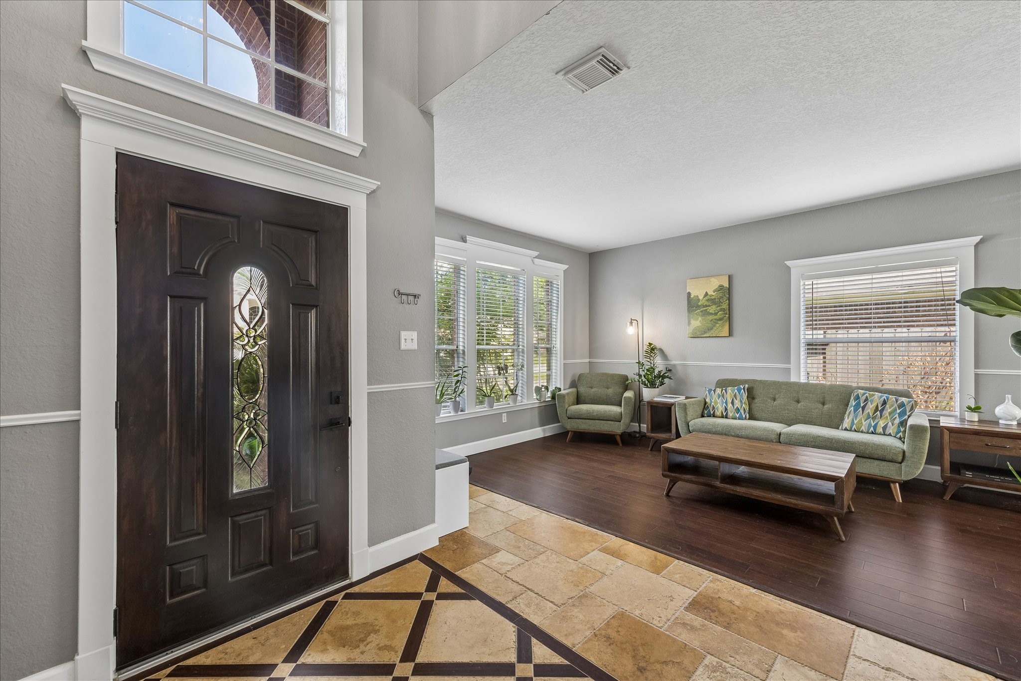 23234 Grand Rapids Lane Spring, TX 77373 - Photo 4 of 30 Impressive foyer with soaring ceilings and a rich wood door opens into a bright, comfortable living space filled with natural light.