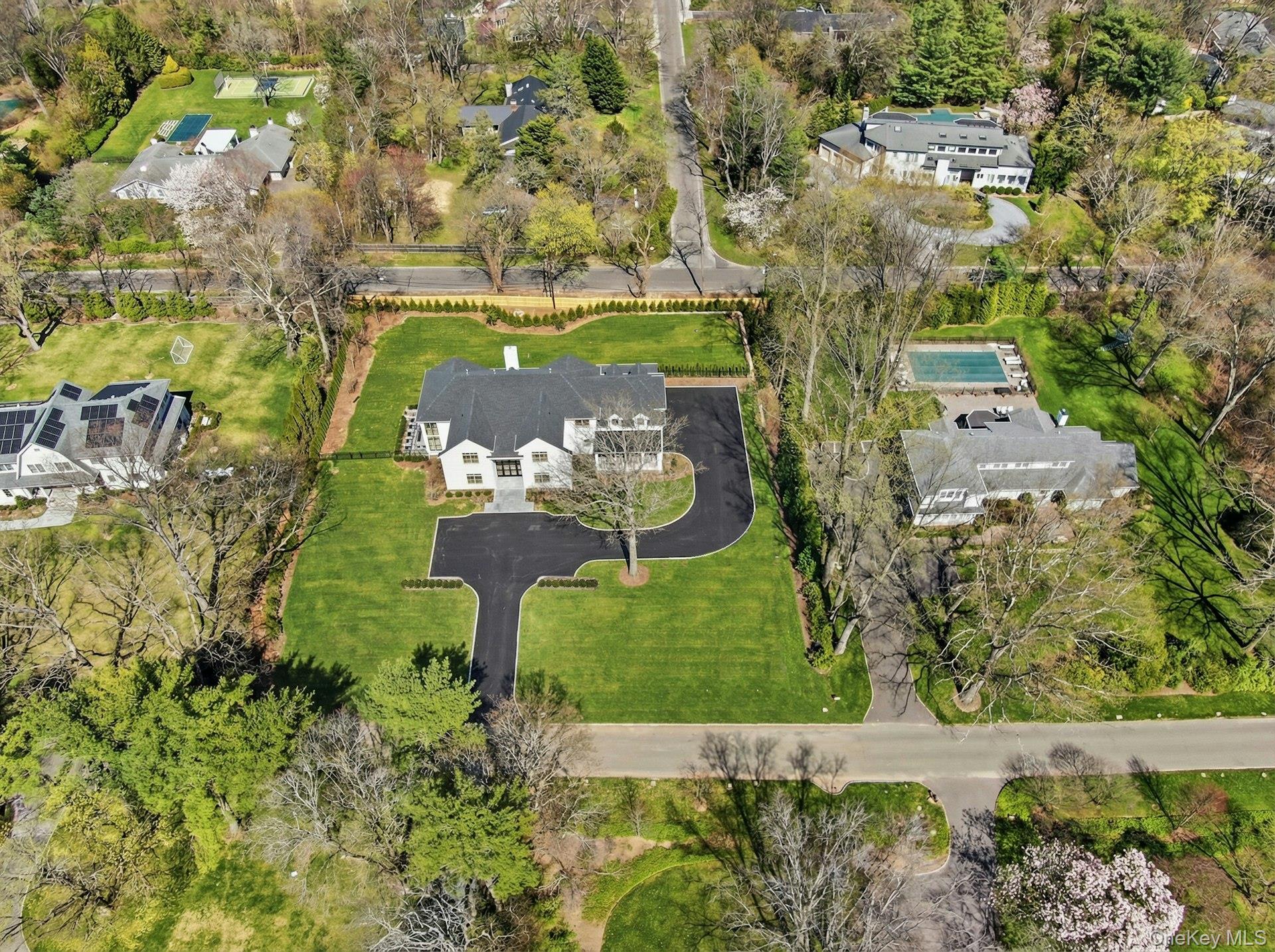 25 West Creek Farms Road Sands Point, NY 11050 - Photo 37 of 39 an aerial view of a house with a yard