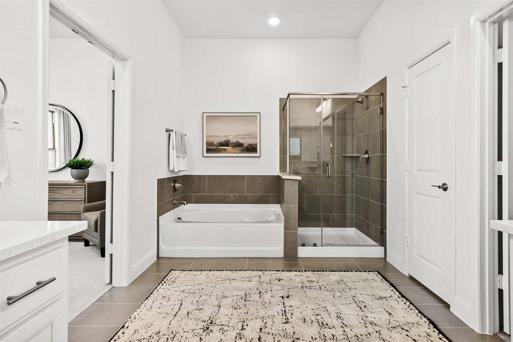 1439 Canadian Lane Van Alstyne, TX 75495 - Photo 13 of 21 a bathroom with a bathtub and a shower