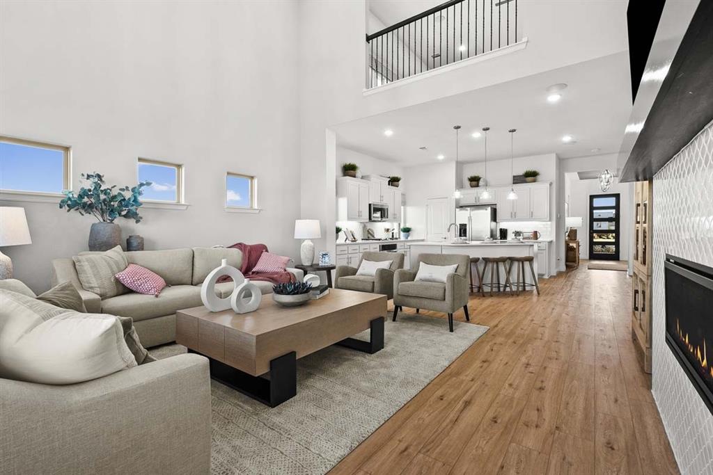 1439 Canadian Lane Van Alstyne, TX 75495 - Photo 3 of 21 a living room with furniture and a wooden floor