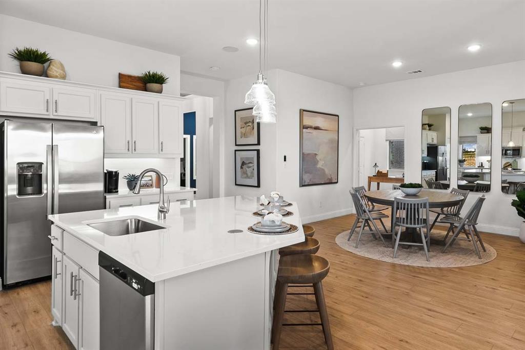1439 Canadian Lane Van Alstyne, TX 75495 - Photo 4 of 21 a kitchen with granite countertop a sink and cabinets