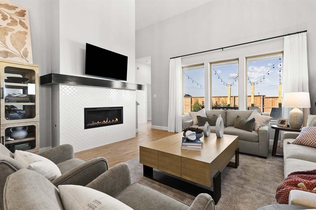 1439 Canadian Lane Van Alstyne, TX 75495 - Photo 8 of 21 a living room with furniture and a flat screen tv