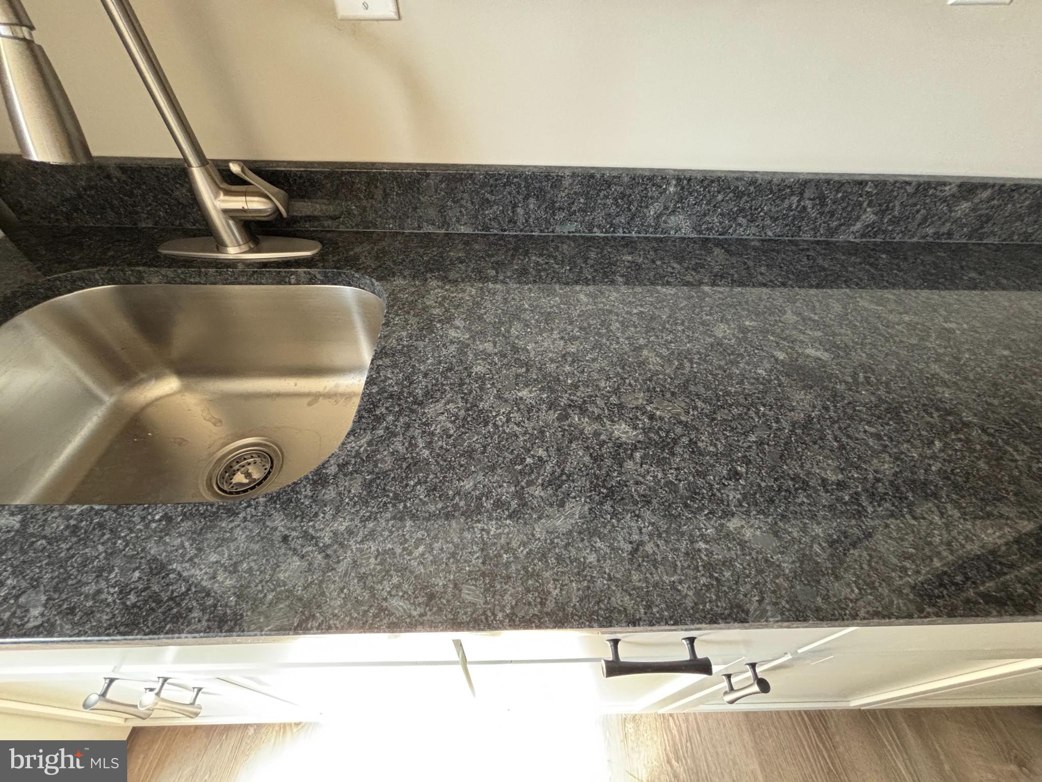 116 West 30th Street, Unit 5 Wilmington, DE 19802 - Photo 8 of 8 a view of sink and mirror