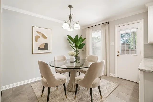 a dining room with furniture and window
